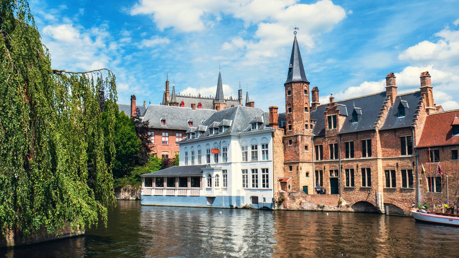 Bruges storybook canal with swans and gabled houses