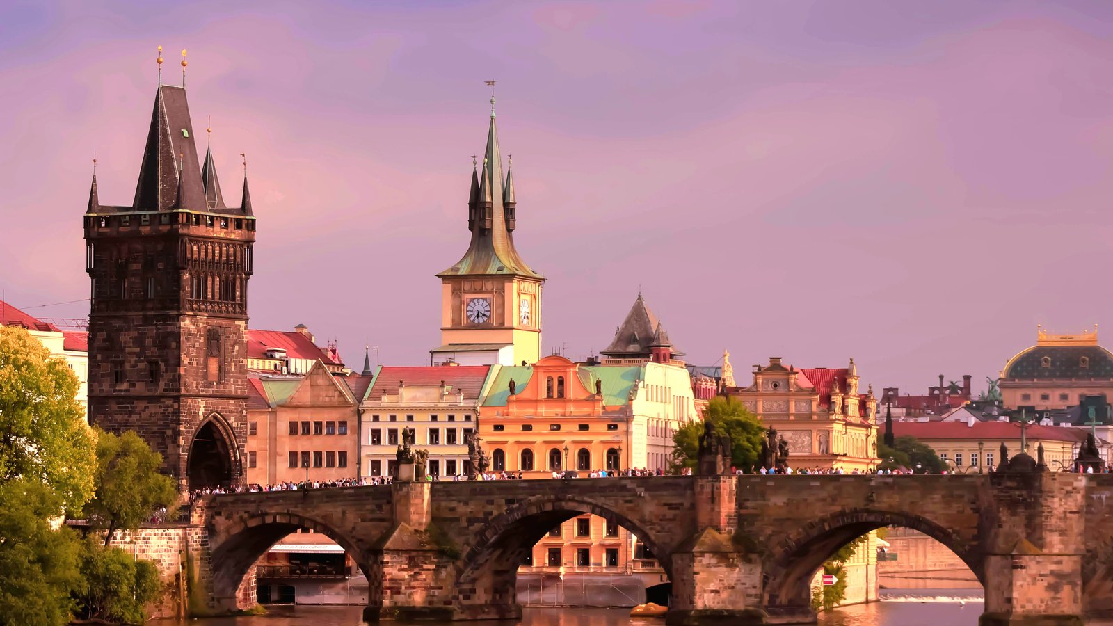 Prague Charles Bridge at dawn with mist over the Vltava
