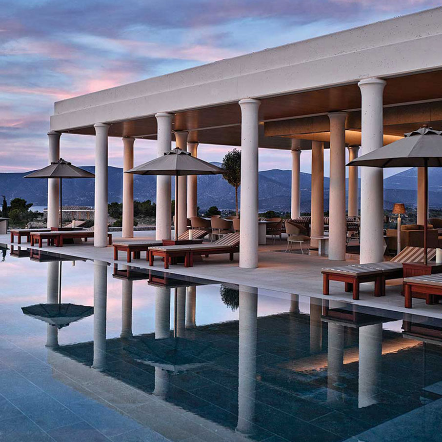 An Amanzoe villa's exterior, pool and Greek stone architecture