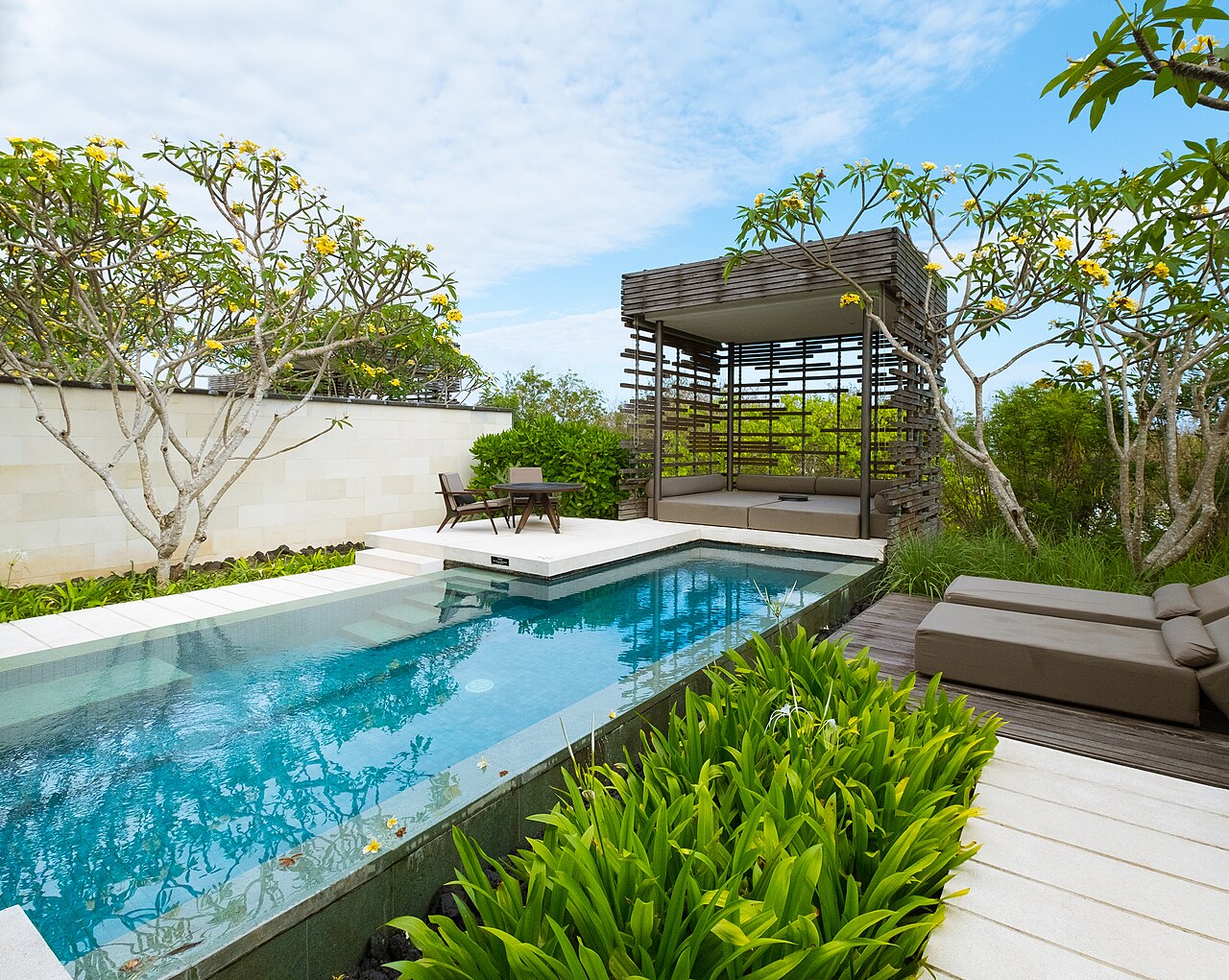 Swimming pool and coastal landscaping at Alila Villas Uluwatu Bali