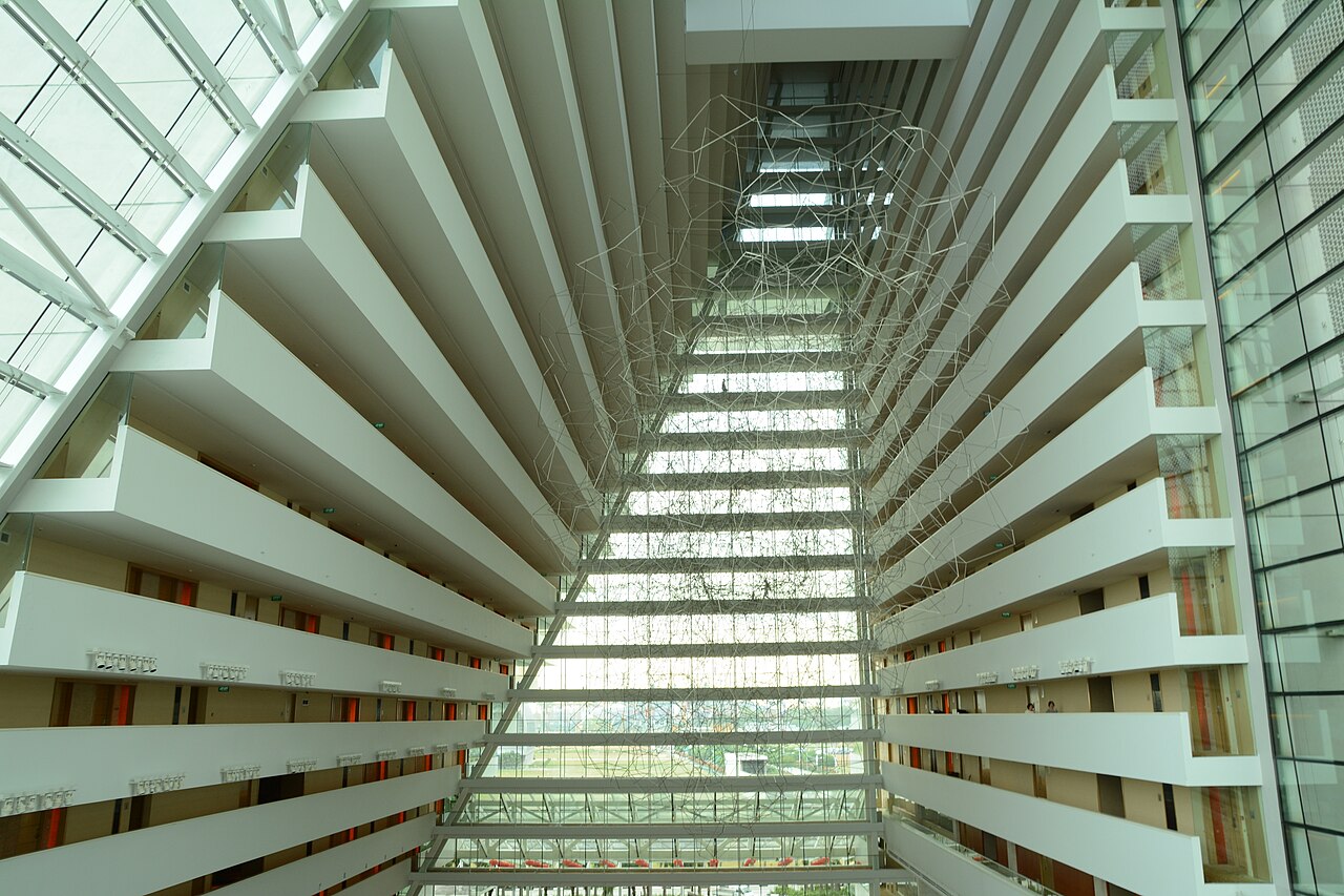 Bright open-air atrium and balconies of Marina Bay Sands hotel photographed in 2015