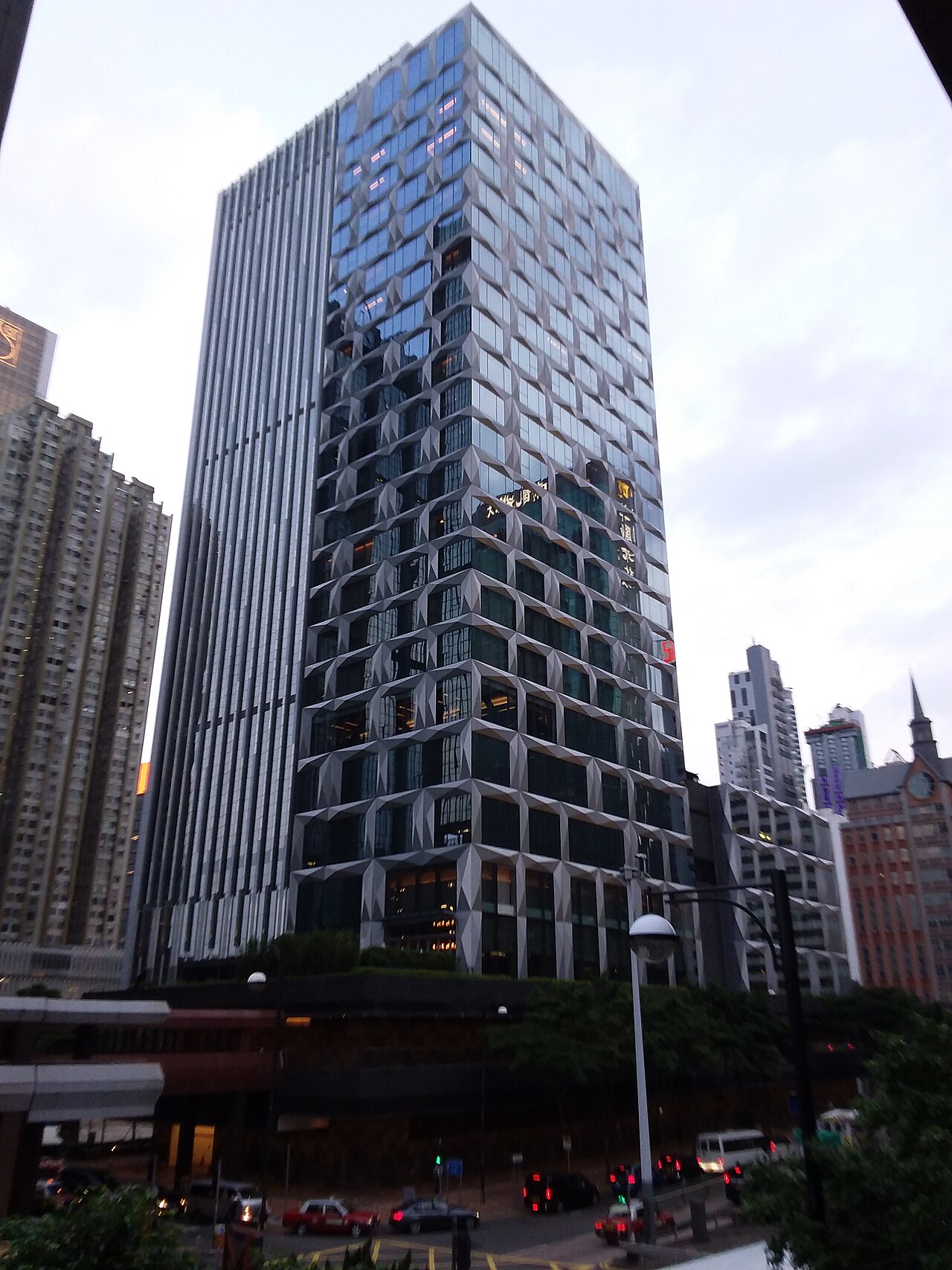 St Regis Hong Kong hotel exterior in the dense Wan Chai urban city streetscape